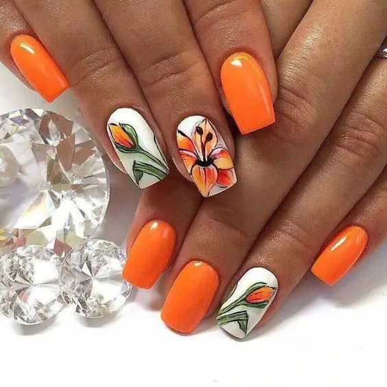 fotos bonitas de unhas decoradas laranja com flores