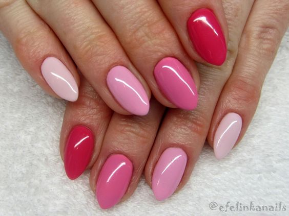 unhas em gel decoradas com tons simples e bonitos na cor vermelha e rosa