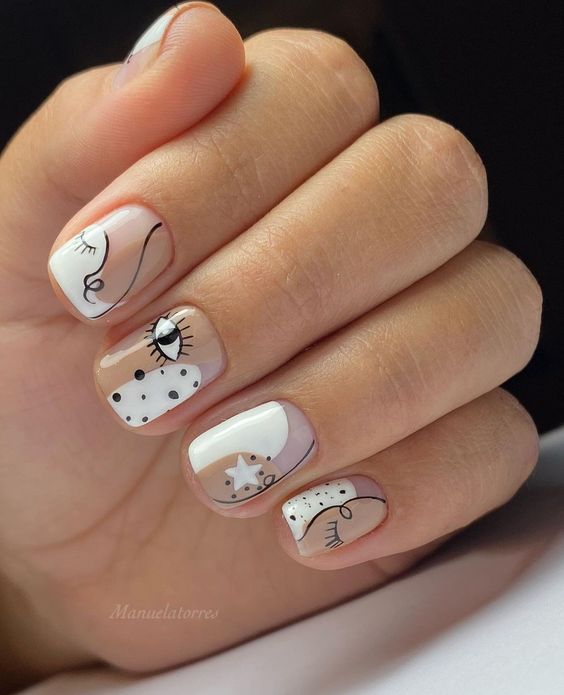 modelo de unhas curtas com desenhos diferentes