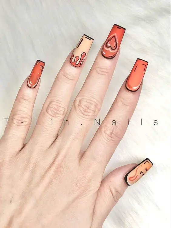 Unhas compridas laranjas com desenhos de quadrinhos