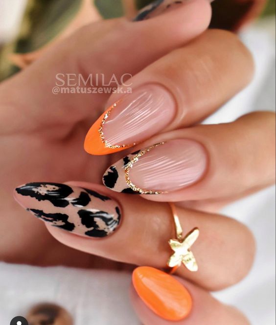 Esmaltação laranja com oncinha